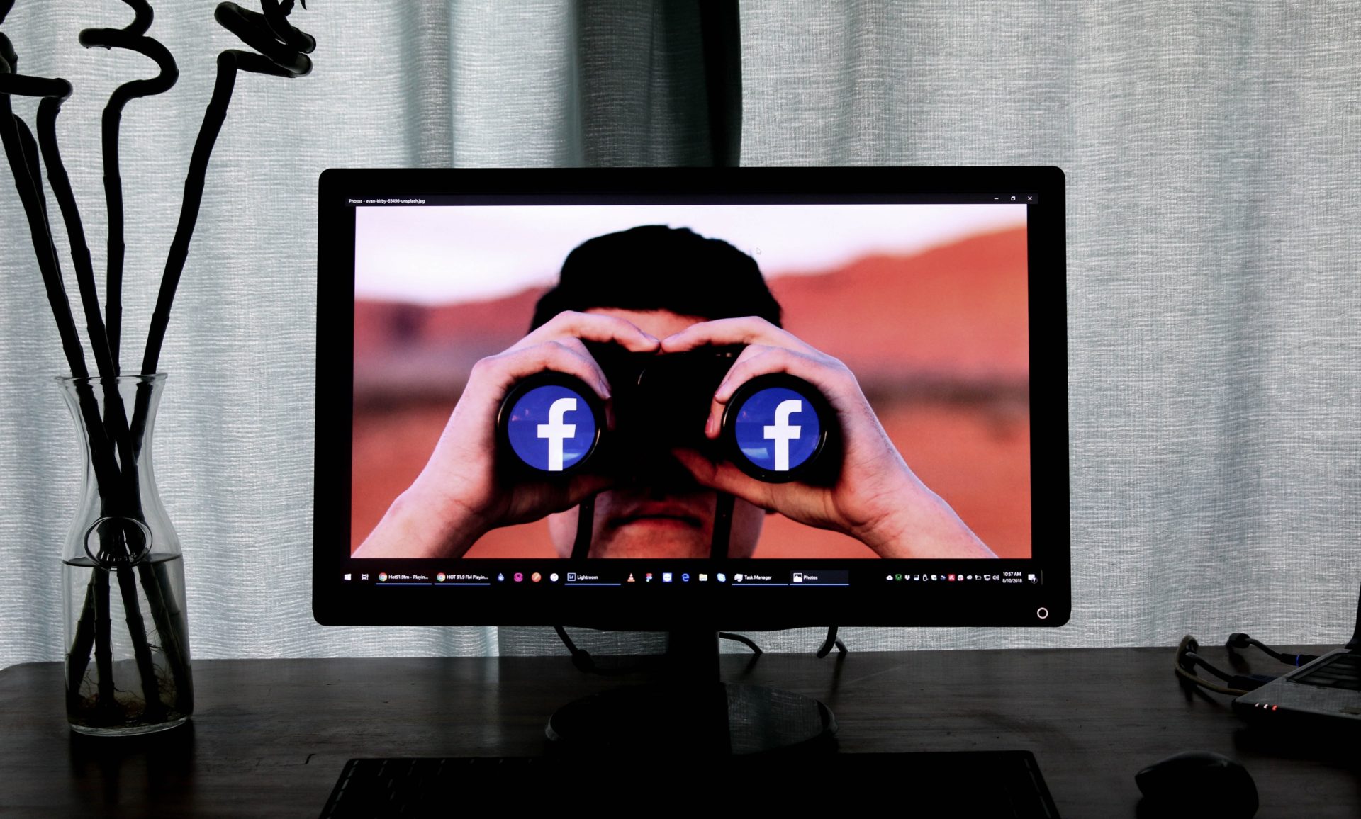 Man Using Facebook Binoculars to Look at You